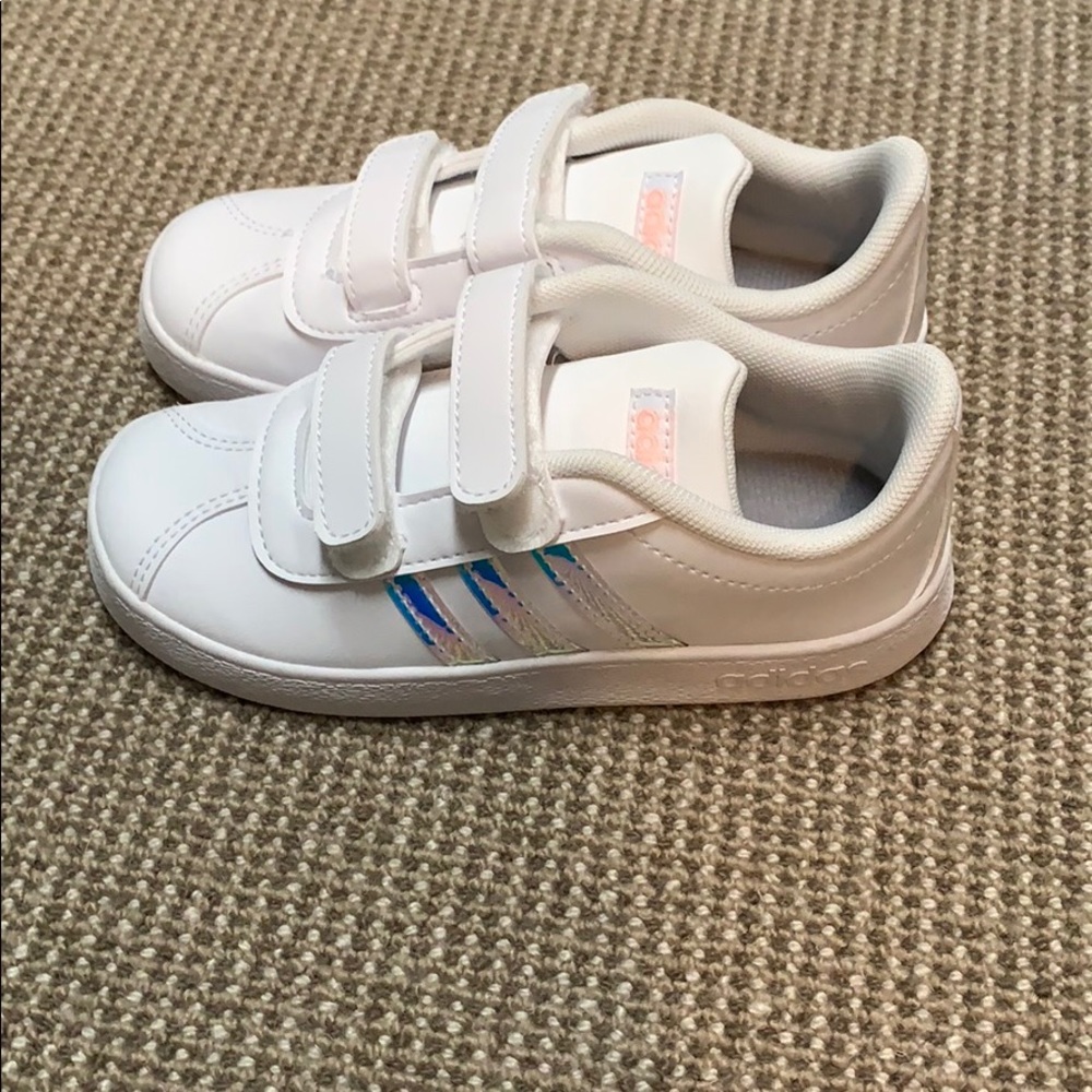 Brand new adidas sneakers with iridescent stripes